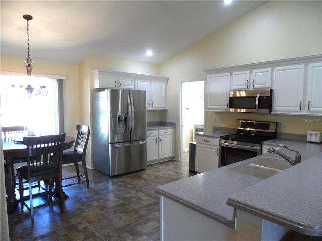 Look at this kitchen!  All LG appliances and corian counter tops