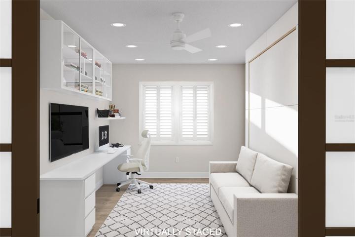 Virtually staged to show flex room with doors & sofa bed.