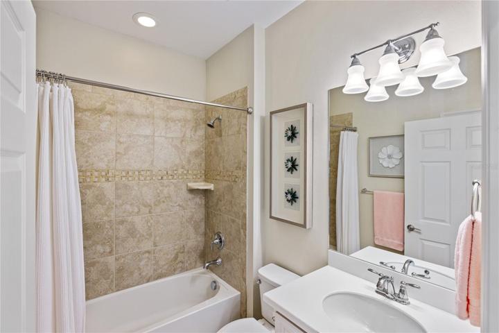 Linen closet included in the guest bath.