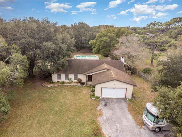 One acre of land near Orange County with house, RV hookup and pool