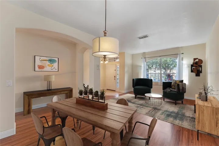 Living Room/Dining room w/ hall - entryway- view from dining area (virtual)