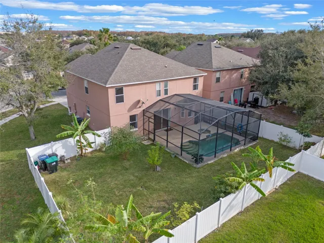 View of large back yard & large pool deck