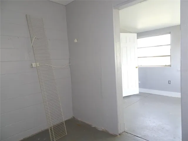 Looking from walk in closet into the 3rd could be bedroom