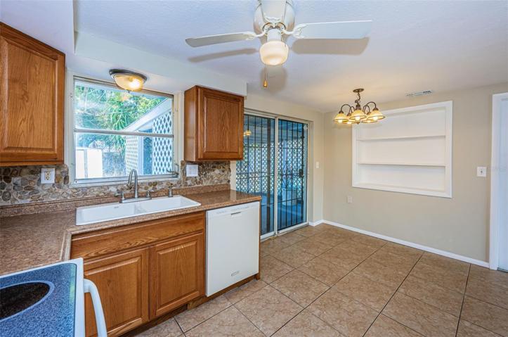 Kitchen with sliders out to screened lanai