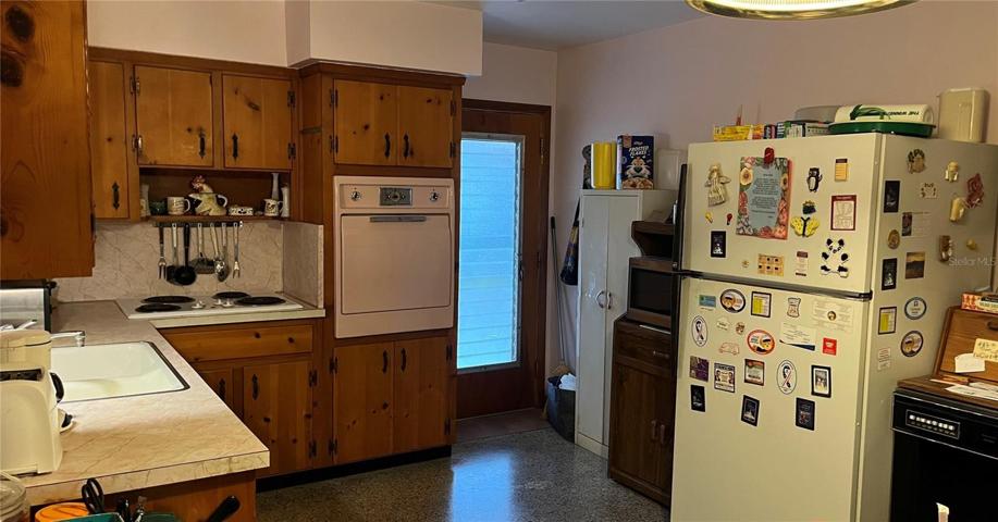 Kitchen with Entry Door closed from Carport and Laundry access