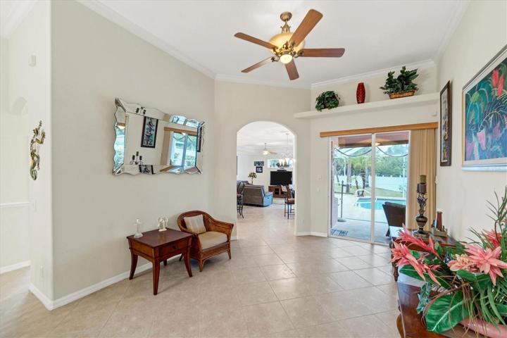 Living room crown molding, plant shelf, lanai access