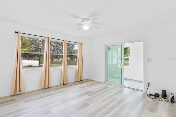 Living room with sliding doors to bonus room