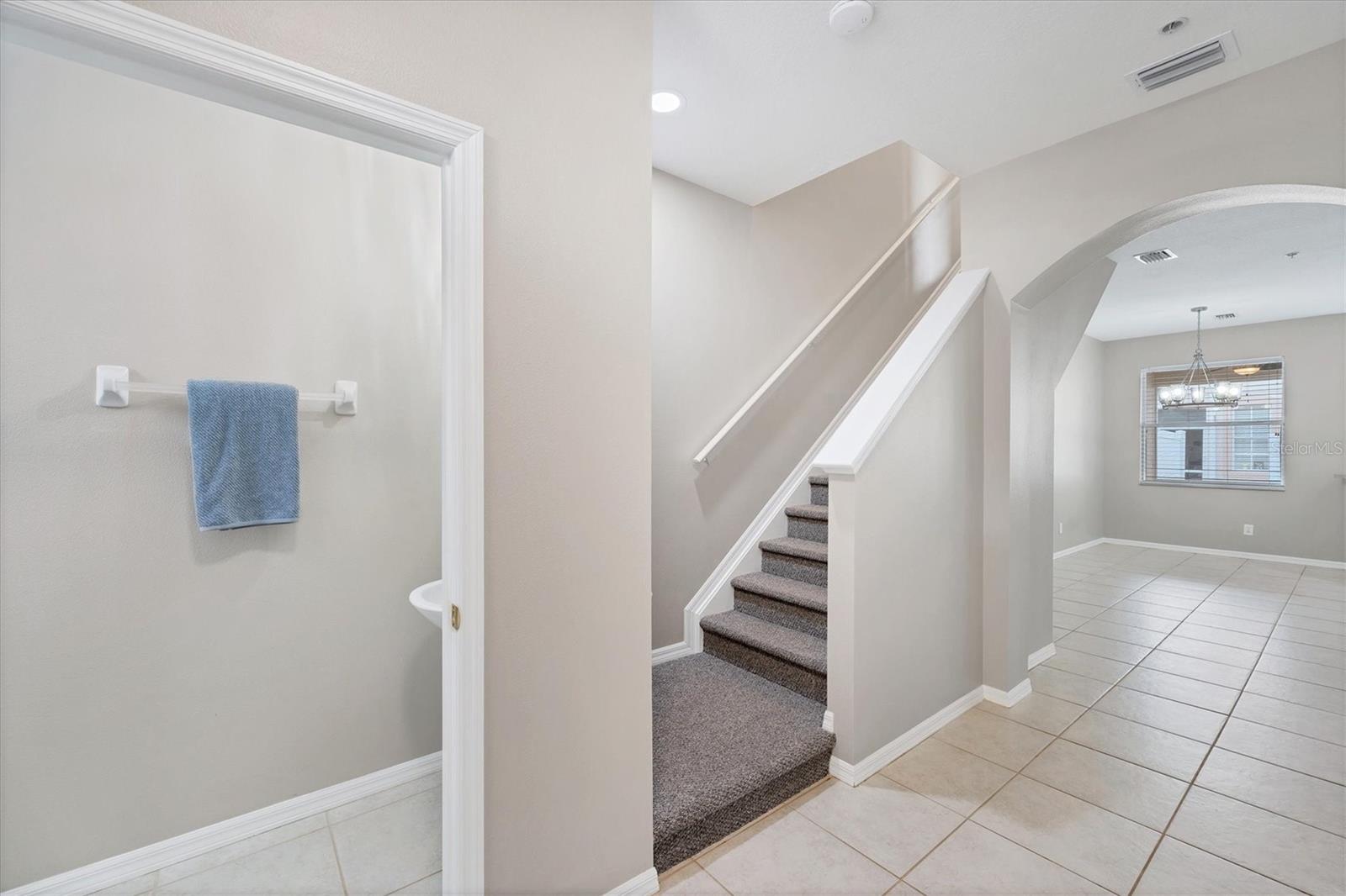 Half Bath for guests at entry foyer; only carpet in the home is on the stairs