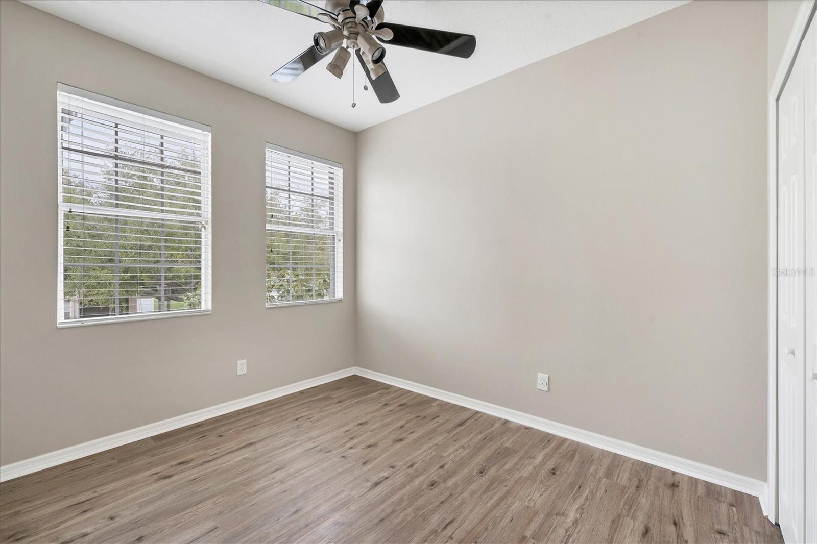 Light, bright large bedroom 2 with luxury vinyl
