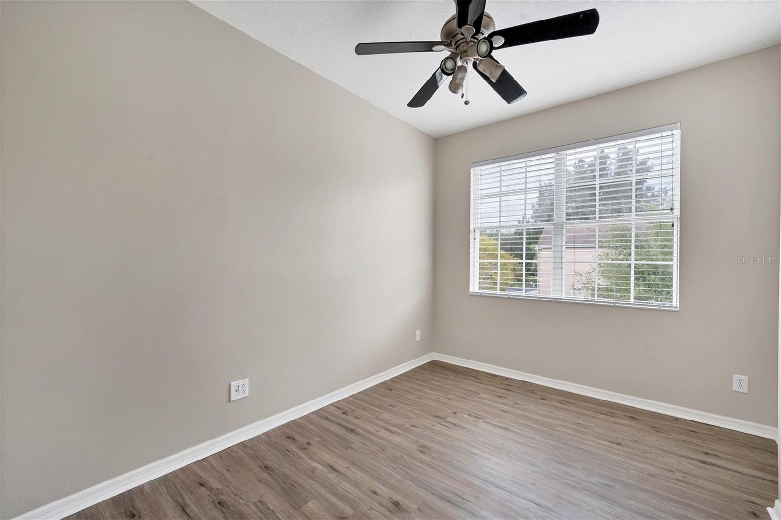 Bedroom 3 with luxury vinyl flooring