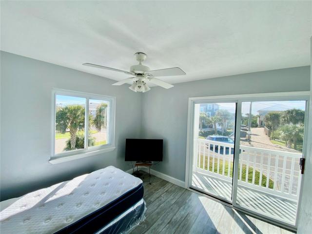 Guest bedroom with slider to balcony