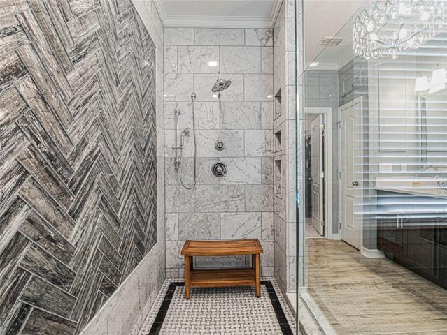 Custom marble and glass tile walk in shower
