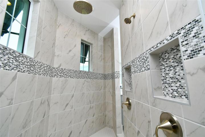 Roman shower; There's no better place to prepare for your day than this beautiful space.