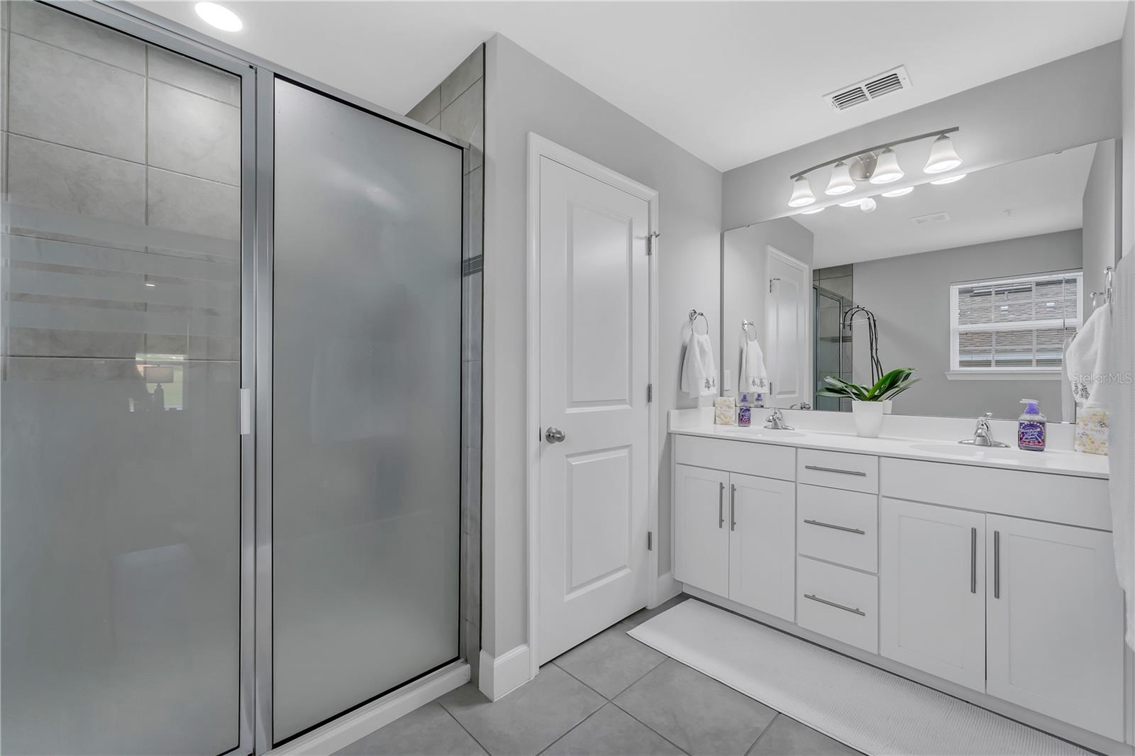 OWNERS BATHROOM WITH DOUBLE SINK + SHOWER