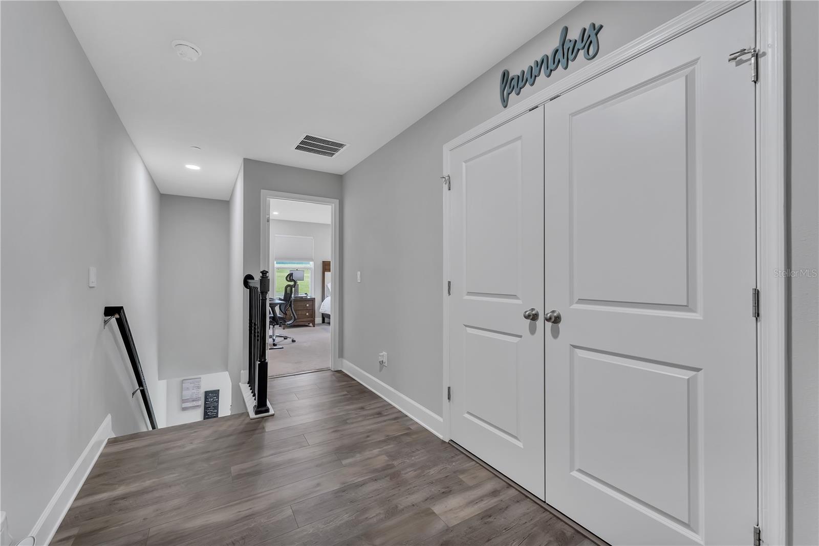 LUXURY VINYL PLANKS AT 2ND FLOOR FOYER