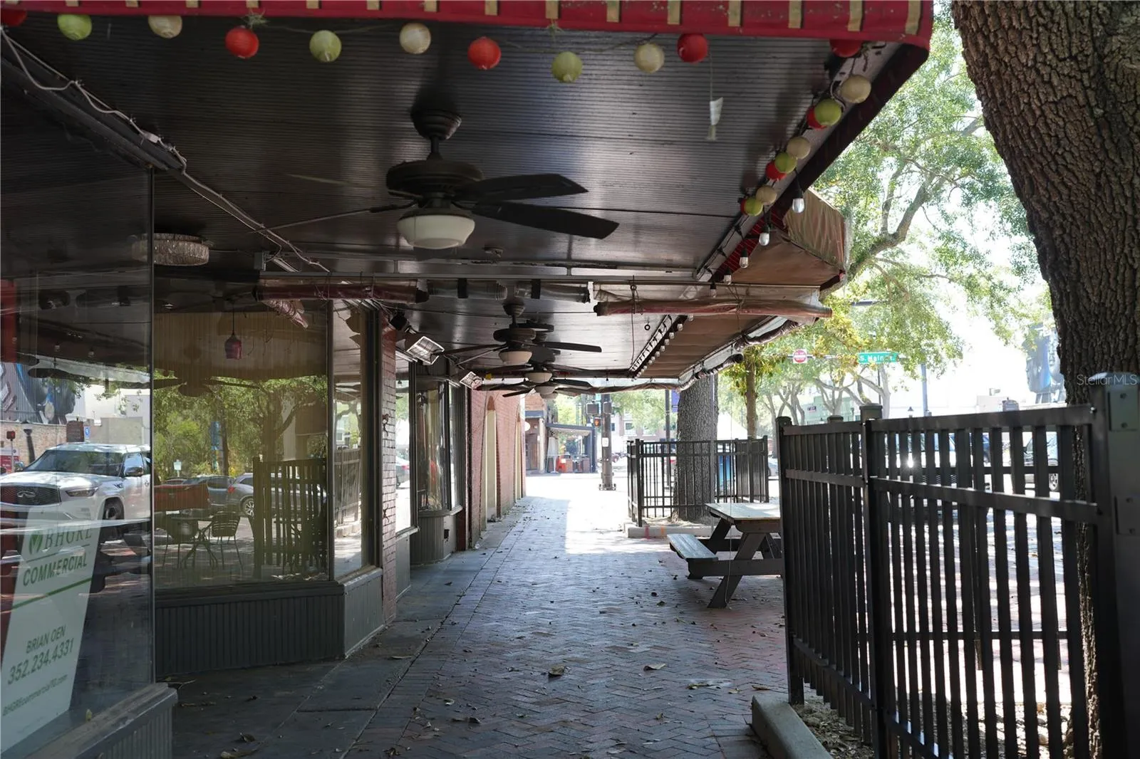 Covered dining area with fans and heaters.