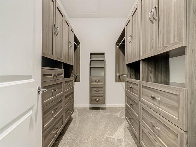 Primary bedroom with custom closet organizer