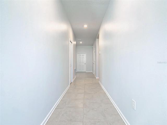 Hallway to other 3 bedrooms