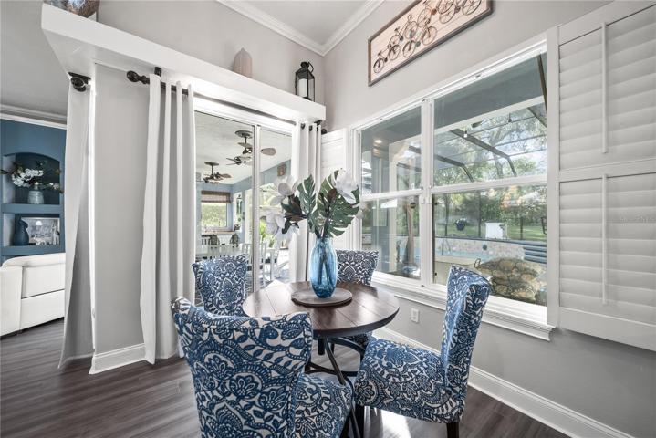 For something a little more, there's a breakfast nook with views out to the screened in porch