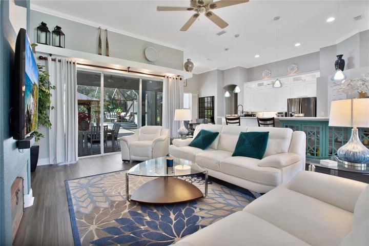 The living room invites entertaining with a great view to the covered porch area