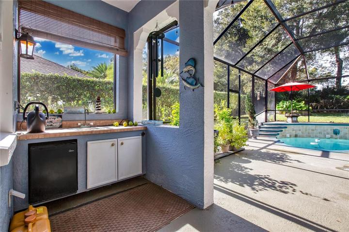 Outdoor kitchen including wet bar