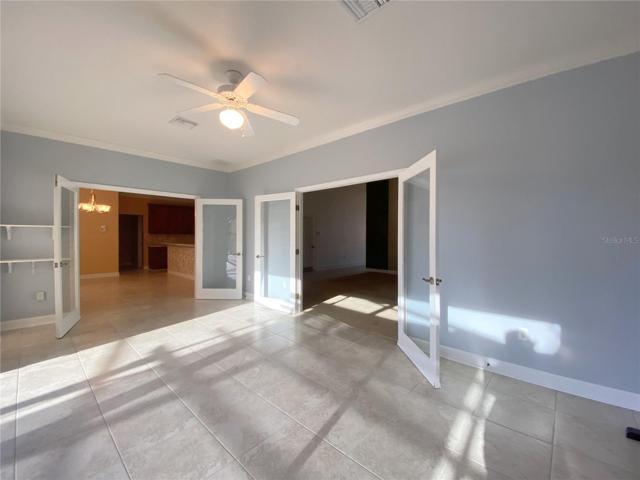 Florida Room with Glass Doors to Eat in Kitchen and Living Room Area
