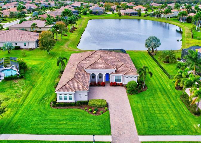 1/2 Acre Lake lot, tile roof, paver driveway