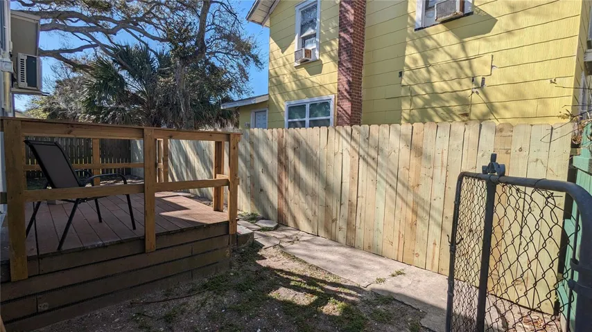 Unit #2 with back deck and fenced yard.