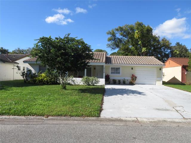 House front with 2 car parking driveways
