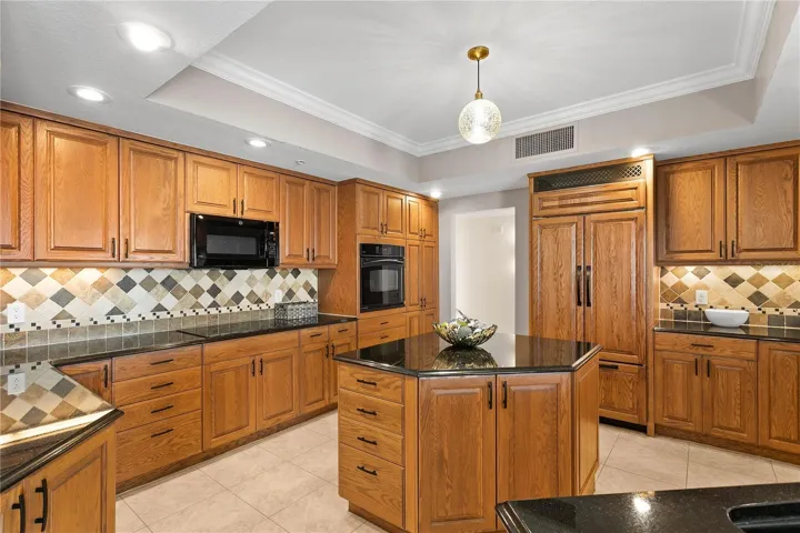 The spacious kitchen has an island with additional storage