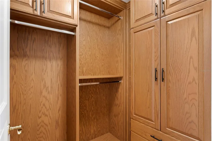 The primary bedroom's organized walk in closet