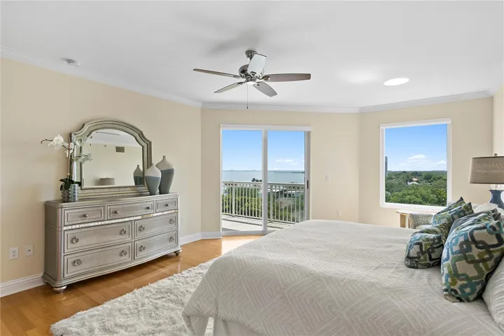 The spacious primary bedroom with natural light