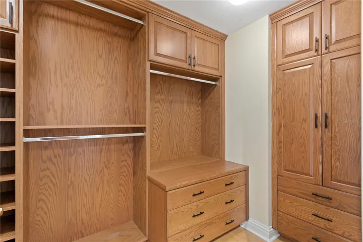 The primary bedroom's organized walk in closet