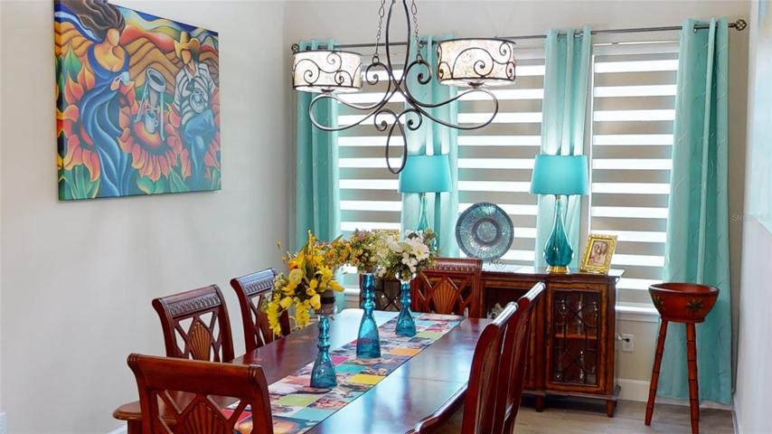 Whether it's an intimate gathering or a festive feast, the formal dining area invites you to revel in its beauty and embrace the joy of sharing moments with loved ones.