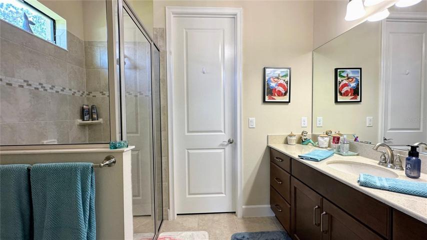 Step into the epitome of luxury with this full bathroom retreat. This space offers both style and functionality, featuring double vanity sinks that provide ample space for your daily routines. The walk-in shower, adorned with modern finishes, promises a rejuvenating experience, while the closet adds a touch of convenience and organization to your lifestyle.