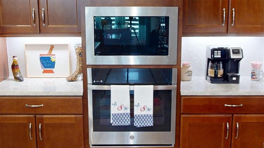 Elevate your culinary experience with the convenience of a wall oven paired seamlessly with a built-in microwave above. This dynamic combination enhances your kitchen's functionality, offering versatile cooking options while preserving valuable counter space