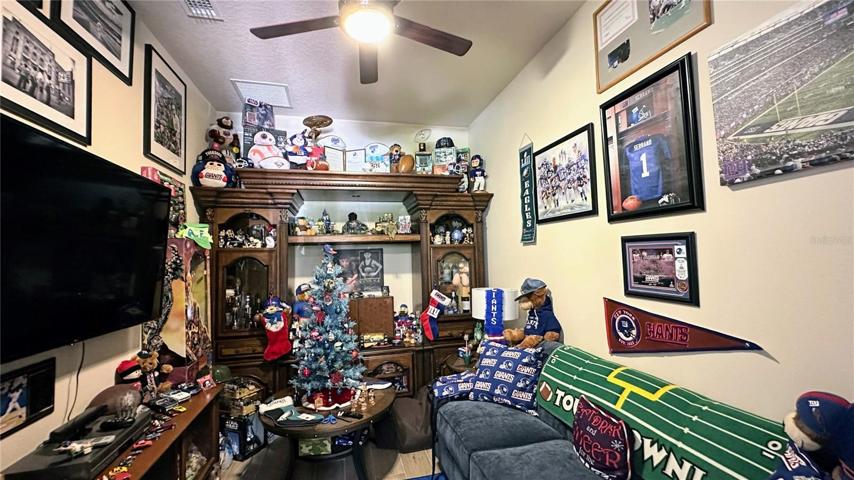 Unlock a world of possibilities with this expansive room, discreetly nestled and accessible only from within the garage. A versatile haven awaits, ready to transform into your ultimate 