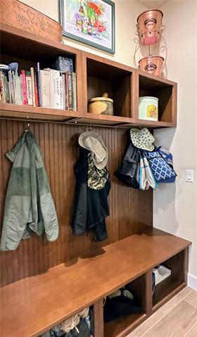 The mudroom offers a dedicated spot to leave your outdoor gear, ensuring a clutter-free living environment. With smart storage solutions and efficient design, this space keeps everything in its place, leaving your home tidy and inviting.