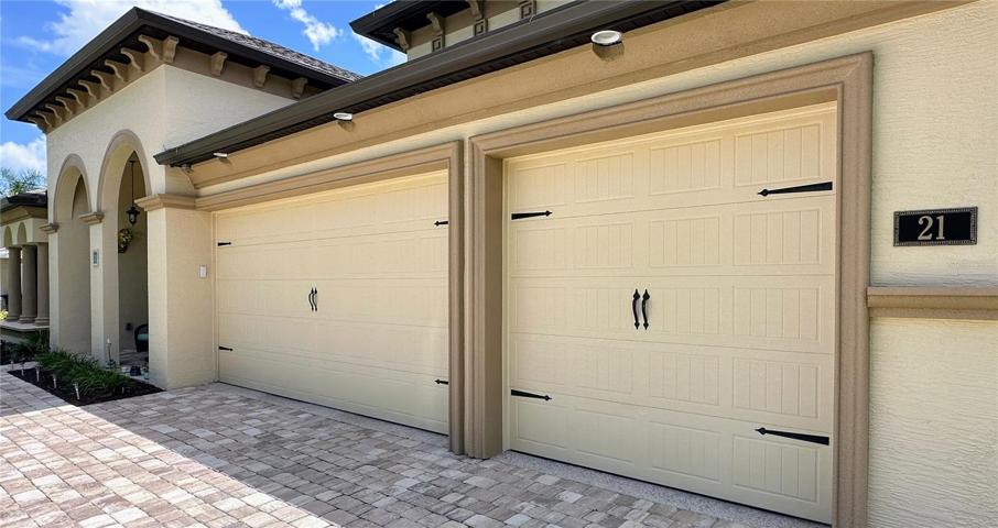 Unlock the potential of space with an oversized garage that goes above and beyond – featuring an extra bay and a private room under heat and air. This remarkable discovery offers not just ample parking but also versatile options for your needs. Whether it's a workshop, storage, or a dedicated hobby room, you'll find endless possibilities in this unique space. PLUS! Unveil a world of convenience with downlighting beneath the eaves and strategically placed electrical outlets. Experience the ease of plugging in holiday lighting without hassle, as these thoughtfully designed features enhance both the aesthetic and practicality of your home.