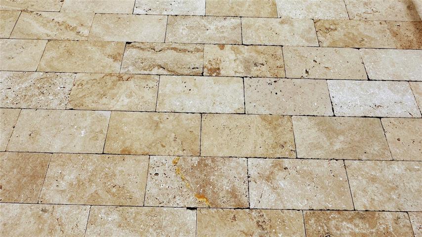 Elevate your poolside experience with a deck adorned in exquisite travertine pavers. The beauty of these natural stone pavers lies in their timeless charm and unmatched elegance. As you step onto the cool, smooth surface, you're embraced by a luxurious sensation that resonates with comfort. The travertine's subtle variations in color and texture create an enchanting tapestry that complements the sparkling waters of the pool.