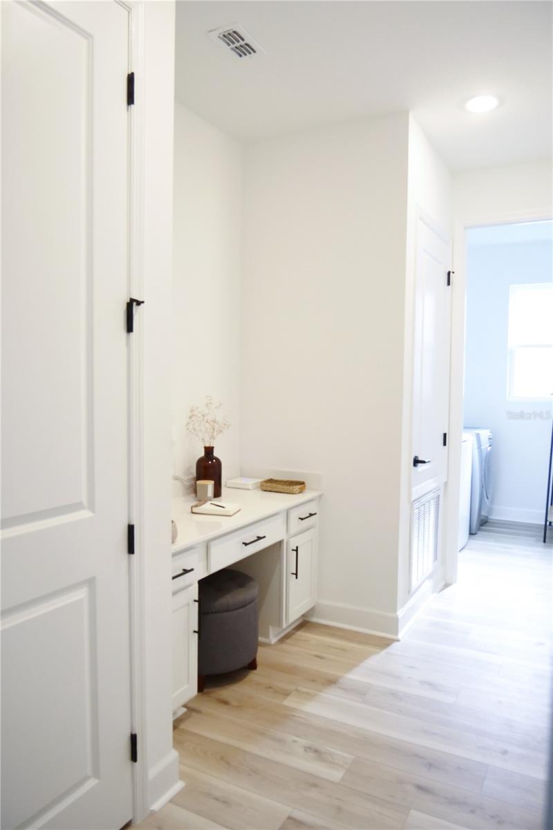 Built in tech desk and separate laundry room