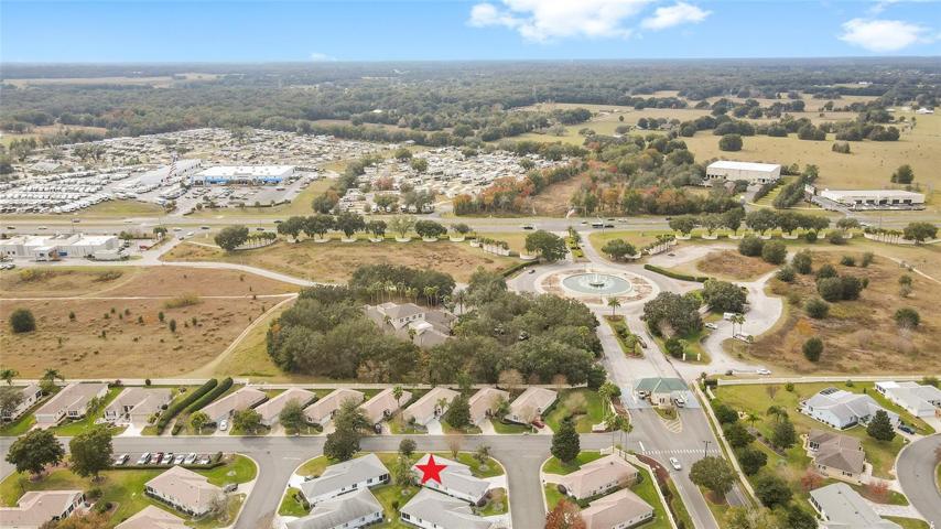 AERIAL VIEW: Entrance with water fountain (right center), US 441 (across center), and HCA Florida Summerfield Emergency Center center left.