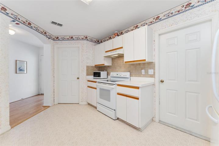 KITCHEN - Interior Laundry (L) and Garage Access (R)