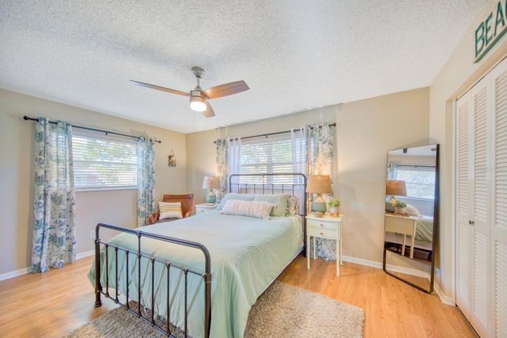 Primary bedroom with wall of closets~