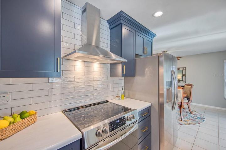 Matching appliances & raised ceiling with new light fixtures~