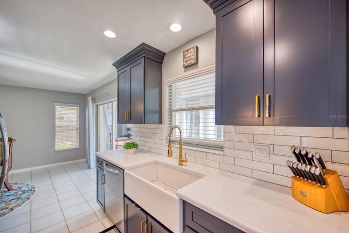 Upgrades include solid surface premium Corian counters, subway tile splash walls & farm sink~