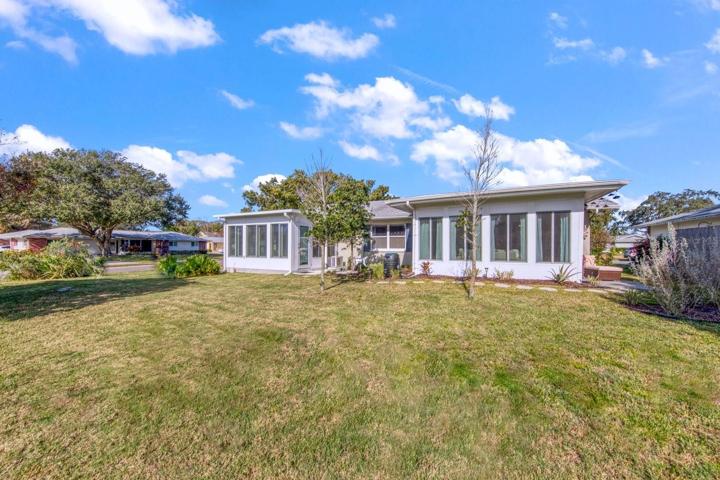 Two additions with landscaped courtyard between~
