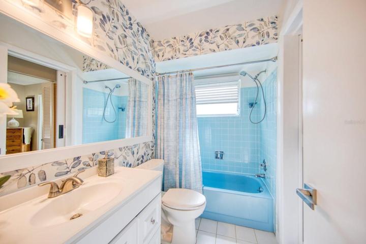 Tub/shower with new vanity, fixtures & coordinating wallpaper~