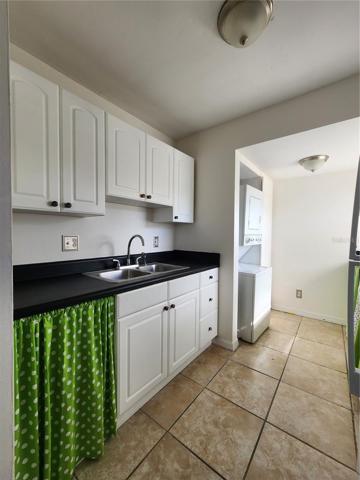 Kitchen with washer and dryer