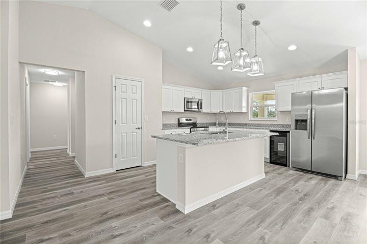 Kitchen area with upgraded lighting fixtures
